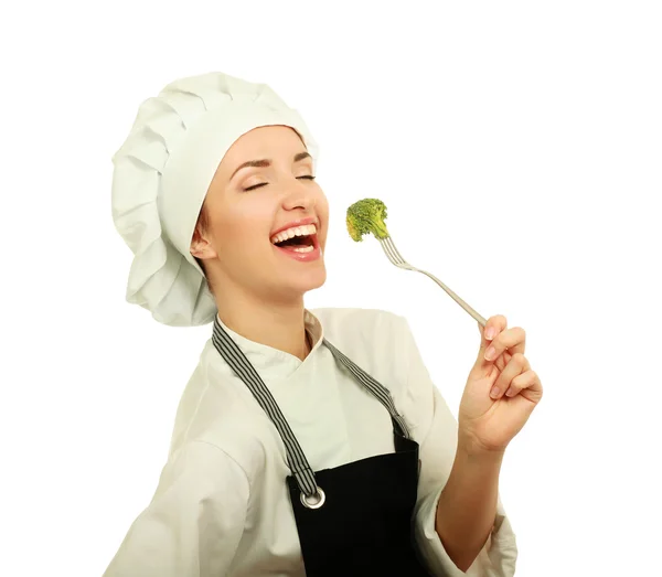 Hezká kuchařka šéf podniku vidlice se salátem — Stock fotografie