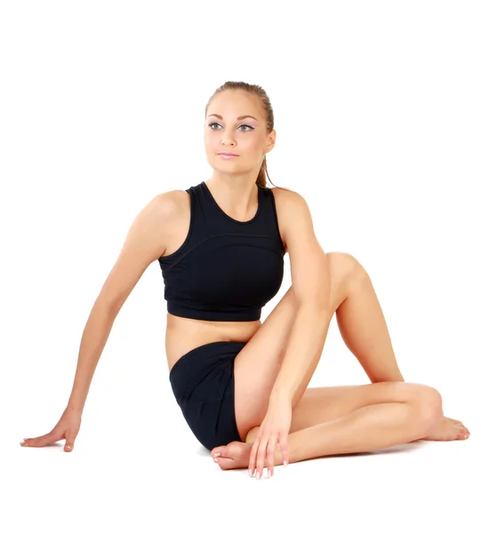 Young woman sitting on the floor — Stock Photo, Image