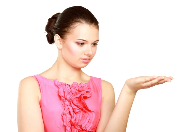 A young woman pointing at something — Stock Photo, Image