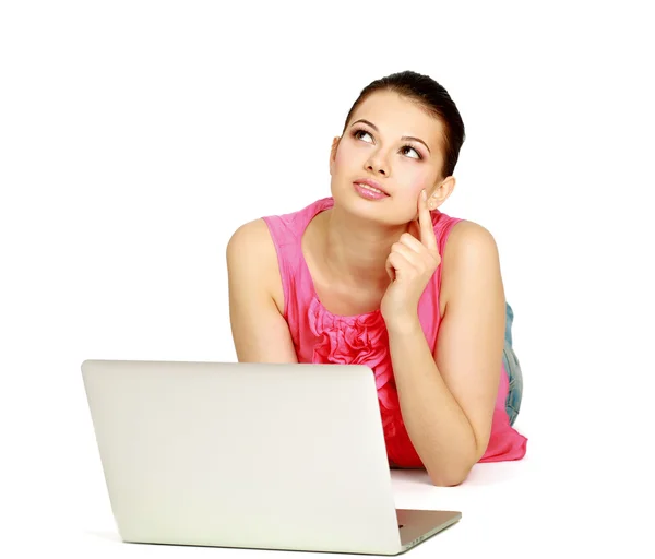 Woman lying on the floor with a laptop — Stock Photo, Image