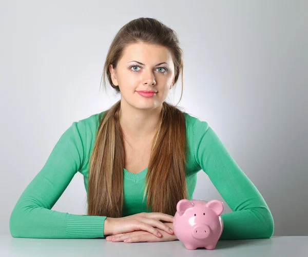 Woman with piggy bank — Stock Photo, Image