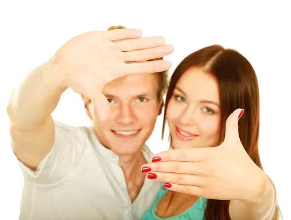 A young couple framing their head — Stock Photo, Image