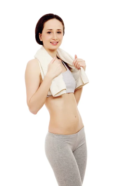 A sportive young woman with a towel — Stock Photo, Image