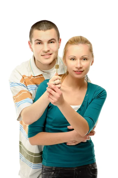 Una giovane coppia felice in possesso di una chiave — Foto Stock