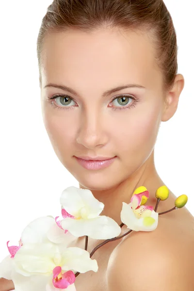 Mujer joven con orquídea Imagen De Stock