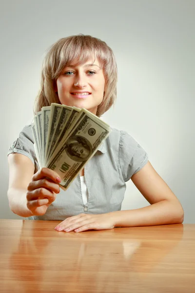 Woman holding dollars — Stock Photo, Image