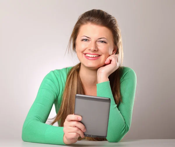 Woman sitting holding computer plane-table — Stock Photo, Image