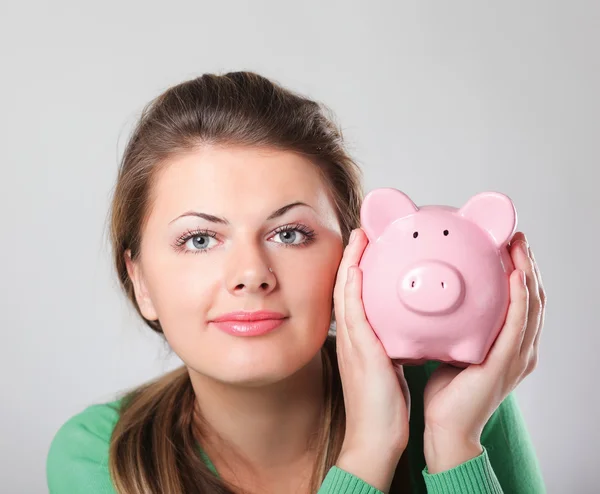 Woman with piggy bank — Stock Photo, Image