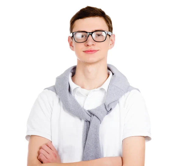 Young man standing with folded arms — Stock Photo, Image