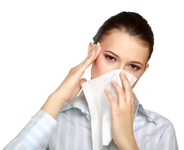 A portrait of a young woman blowing her nose — Stock Photo, Image