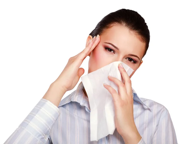 Young woman blowing her nose — Stock Photo, Image