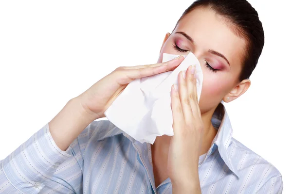 Young woman blowing her nose — Stock Photo, Image