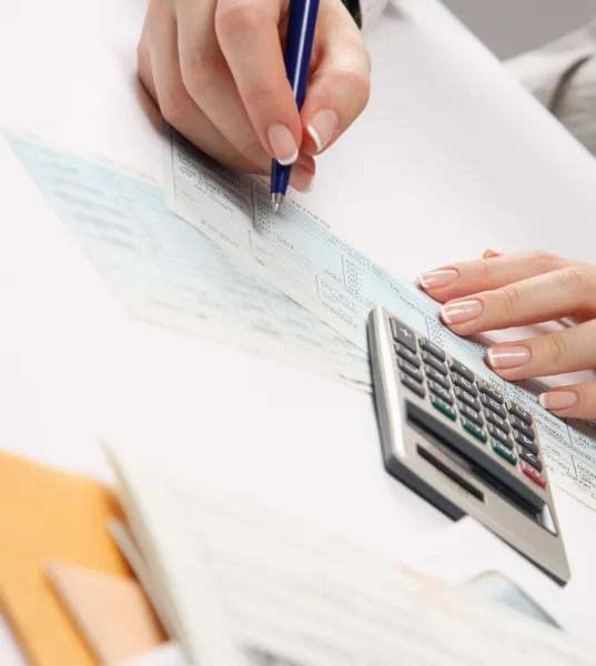 Business woman working with tax documents — Stock Photo, Image