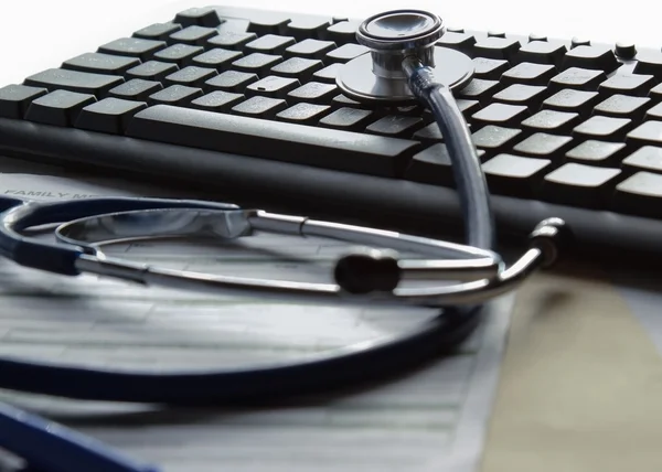 Stethoscope on a computer keyboard — Stock Photo, Image