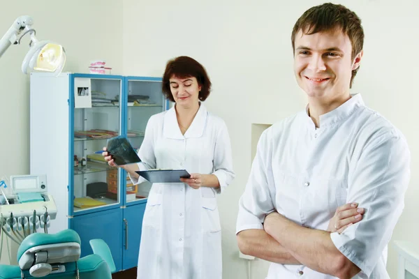 A medical doctors standing in dentist office — Stock Photo, Image