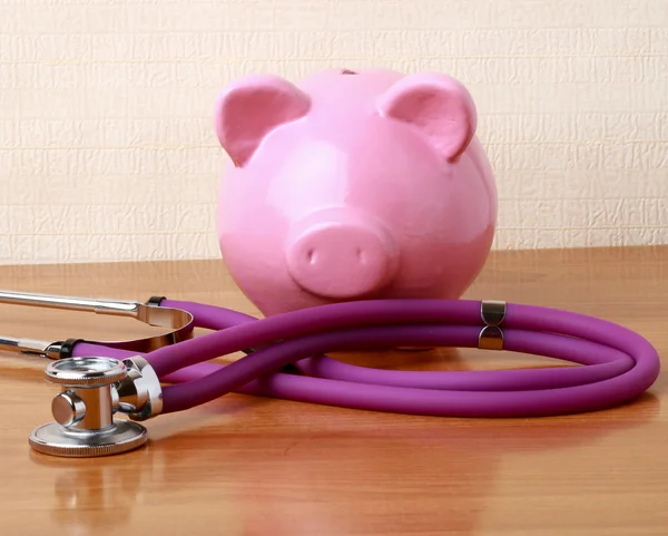 Piggy bank with stethoscope — Stock Photo, Image
