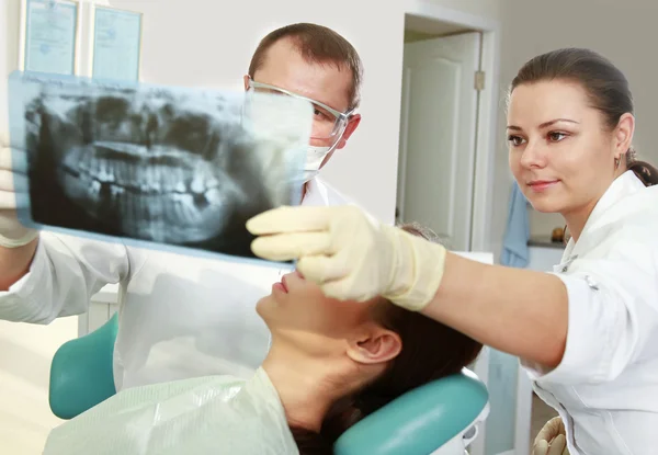 Young woman with dentist — Stock Photo, Image