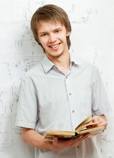 A young man near a diagram — Stock Photo, Image