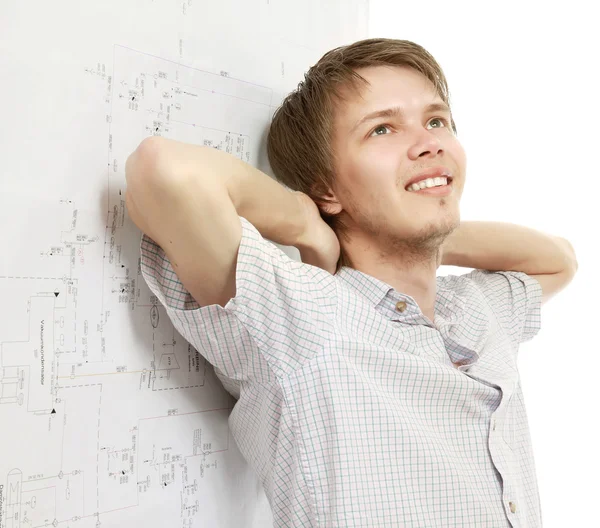 A young pensive man near a diagram — Stock Photo, Image