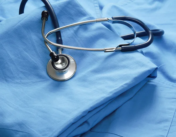 A stethoscope on a medical uniform — Stock Photo, Image