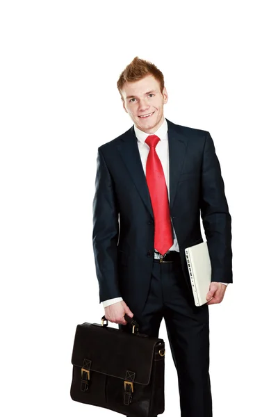 Homem de negócios com saco e laptop segurando — Fotografia de Stock