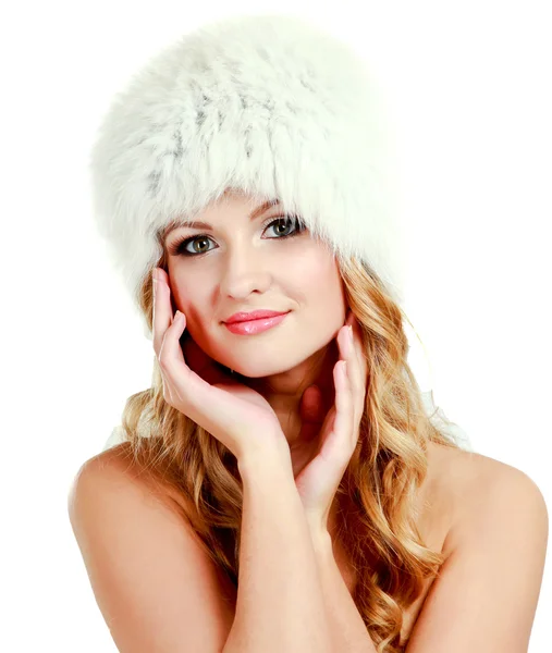 Beauty fashion model girl in a fur hat — Stock Photo, Image