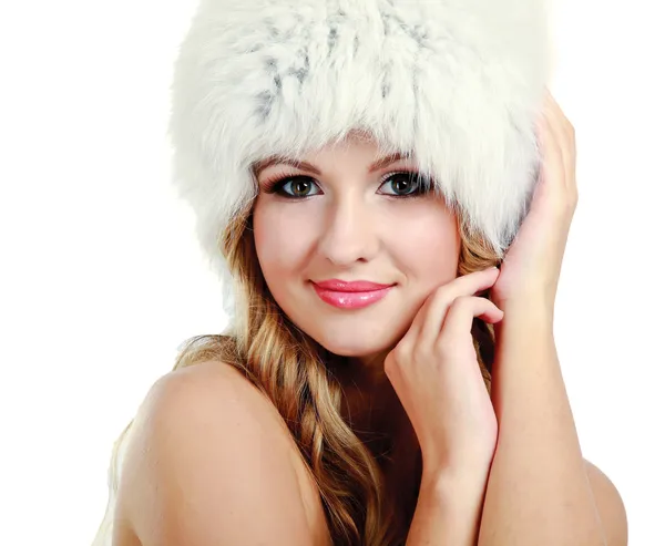 Beauty fashion model girl in a fur hat — Stock Photo, Image