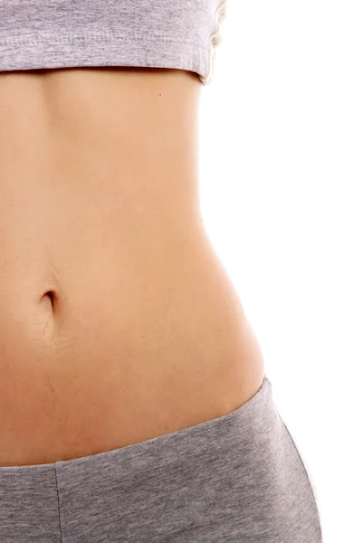 A slim girl, focus on her belly — Stock Photo, Image
