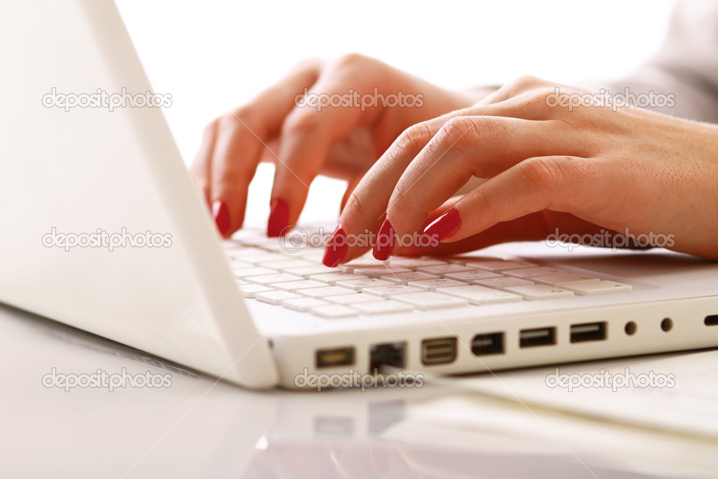 Female hands working on a laptop