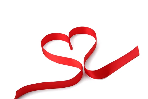 A red ribbon shaping heart — Stock Photo, Image