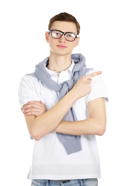 Happy young man pointing at something — Stock Photo, Image