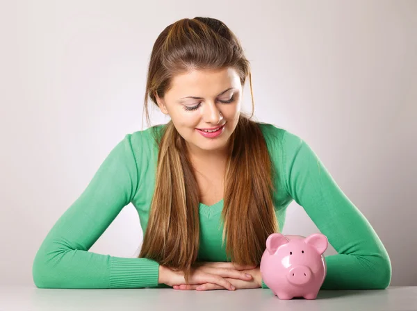 Young beautiful woman with piggy bank — Stock Photo, Image