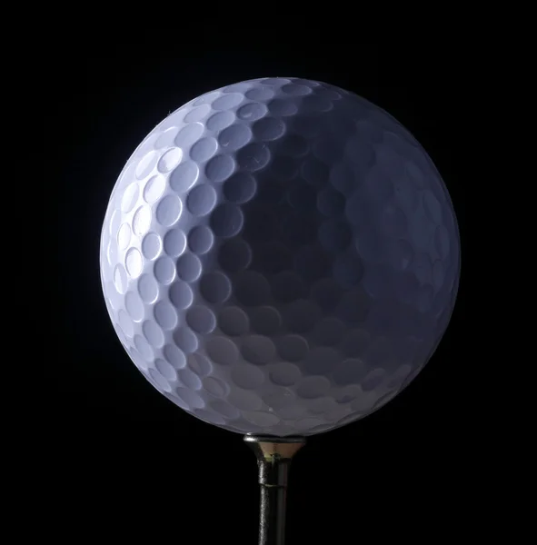 A golf ball on a tee — Stock Photo, Image