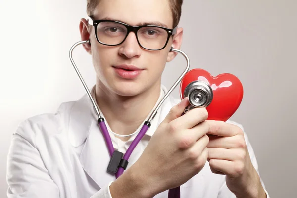 Male doctor using srethoscope Stock Photo