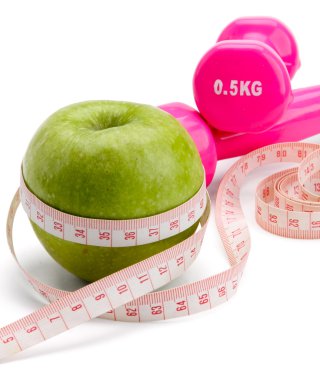 bir elma, bir ölçüm bandı ve dumbbell