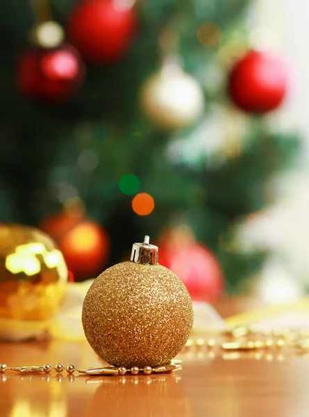 Close up decorative ball on the background of Christmas tree. — Stock Photo, Image