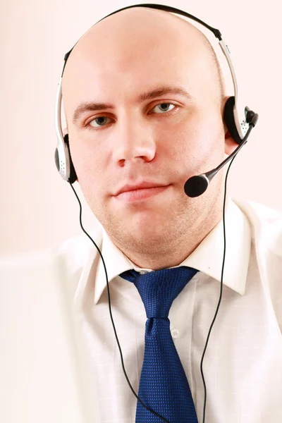 A call center employee with a headset — Stock Photo, Image