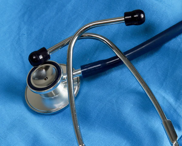 A stethoscope on a medical uniform — Stock Photo, Image