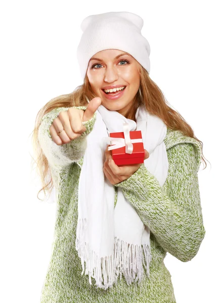 Beautiful woman holding gift and showing ok — Stock Photo, Image