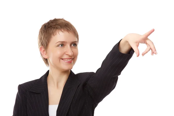 Beautiful businesswoman pointing at something — Stock Photo, Image
