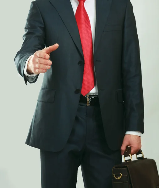 A young businessman giving his hand — Stock Photo, Image