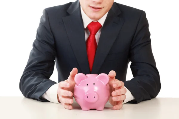 Young man with piggy bank — Stock Photo, Image