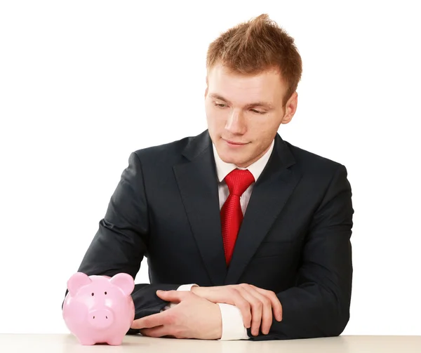 Young man with piggy bank — Stock Photo, Image