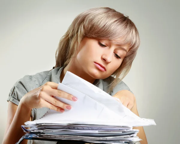 A young tired woman sitting at the desk — Stock Photo, Image