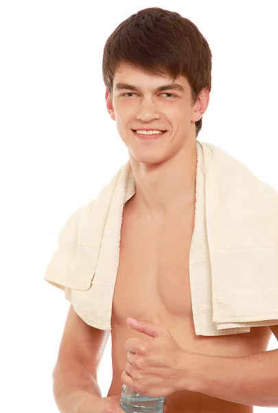 A young sportsman with a bottle of water — Stock Photo, Image