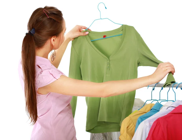 Stylish young girl trying on clothes — Stock Photo, Image