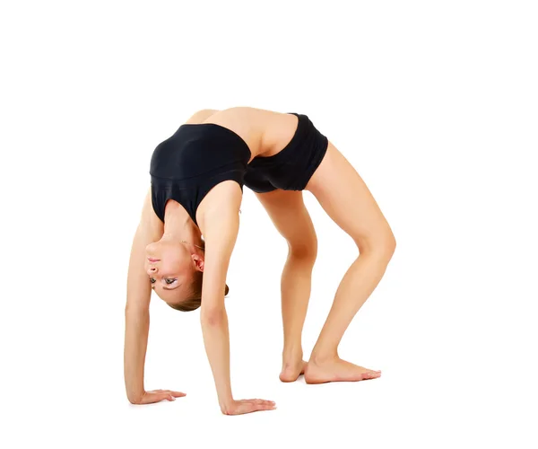 Chica gimnasta en pose de espalda flexible — Foto de Stock