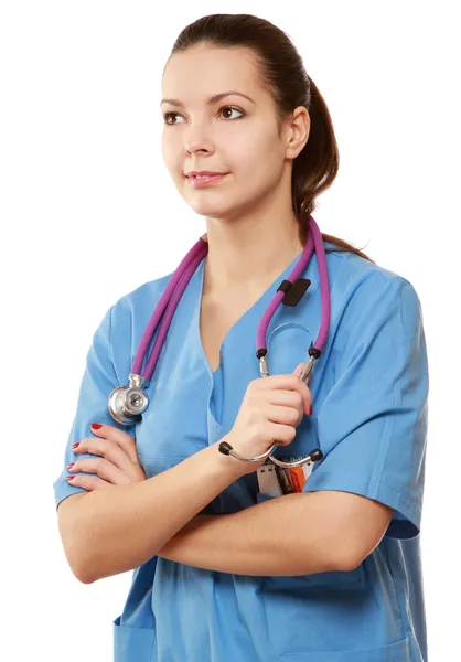 Young nurse standing with folded arms Royalty Free Stock Photos