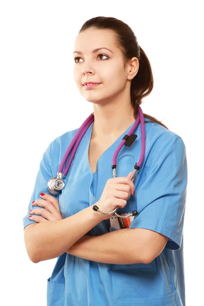 Young nurse standing with folded arms Royalty Free Stock Photos
