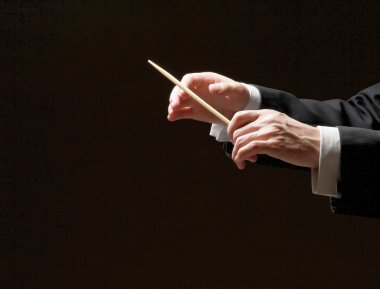 Concert conductor hands with a baton clipart